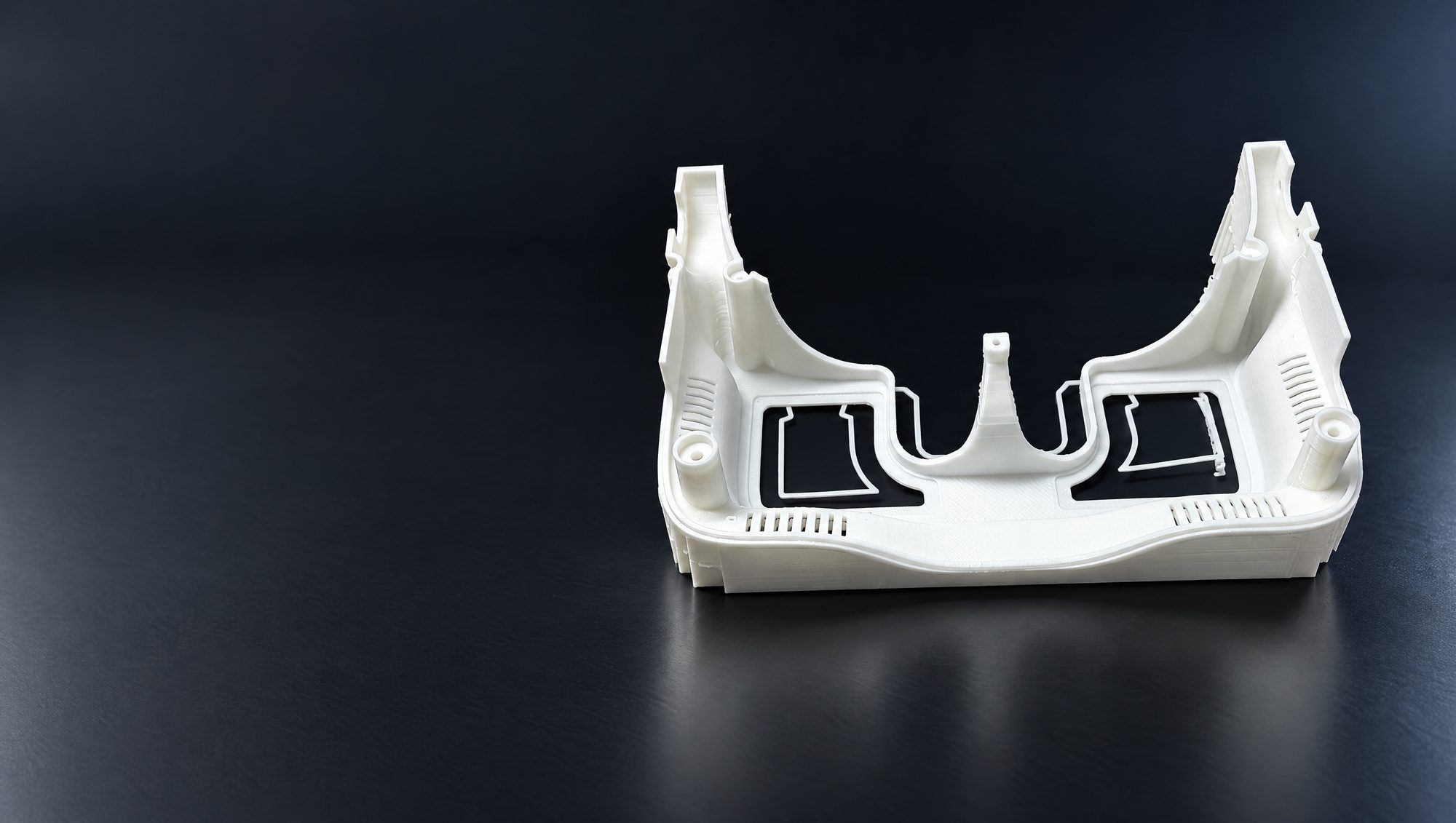 A white printed dashboard console housing