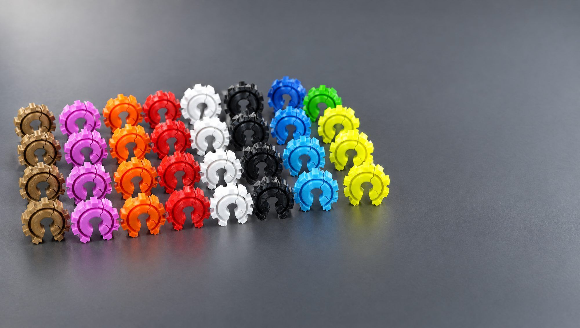 A tidy row of printed gear clips in several colours